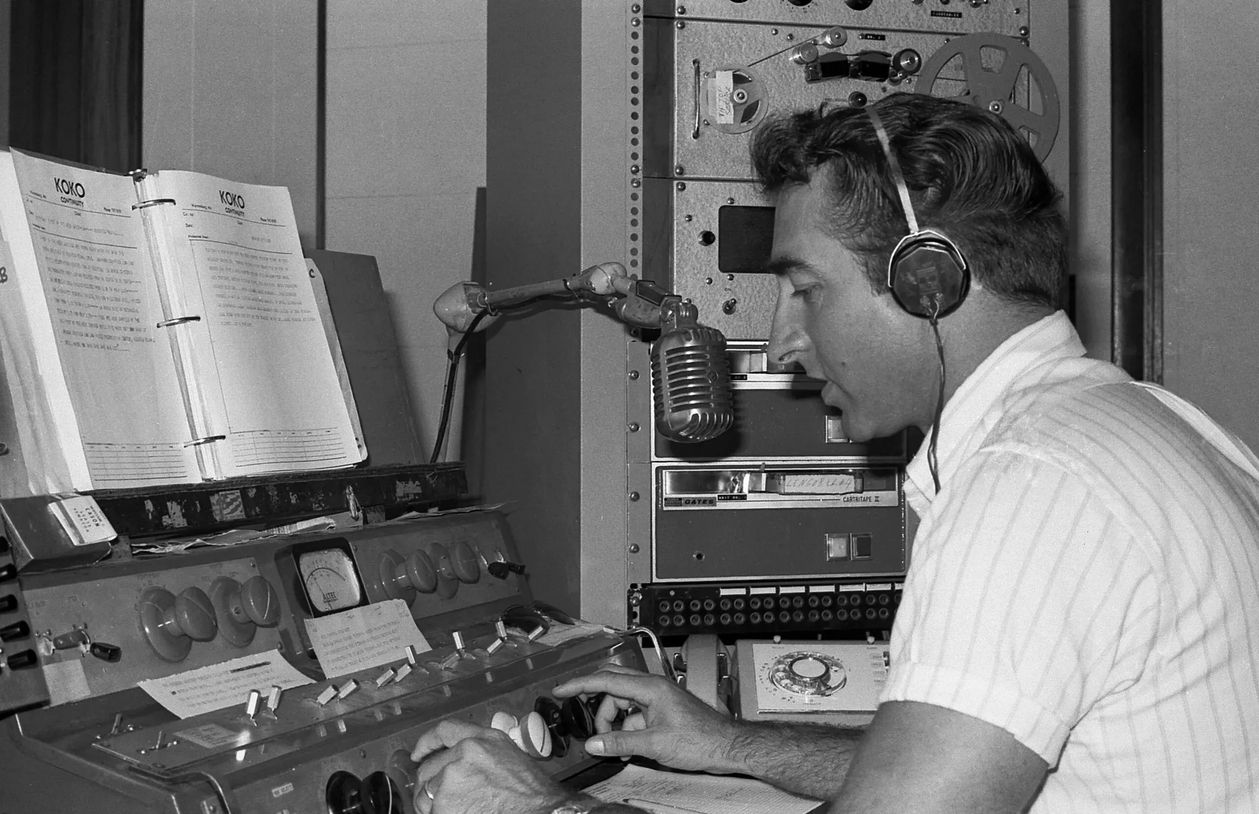 A radio announcer in a broadcasting studio, symbolizing NEXUS-IBA's efforts to bridge the digital divide