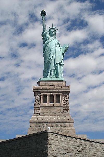Statue of Liberty, a symbol of the American Dream, standing in New York Harbor, representing opportunity and immigration