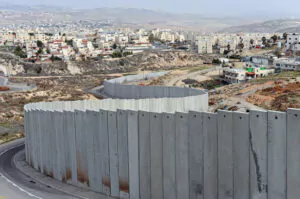 Israeli separation wall divides Shuafat Refugee Camp, Pisgat Zeev Israeli Settlement in West Bank